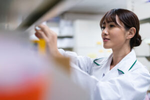 Female pharmacist organizing medications